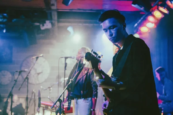 Bryan playing on stage